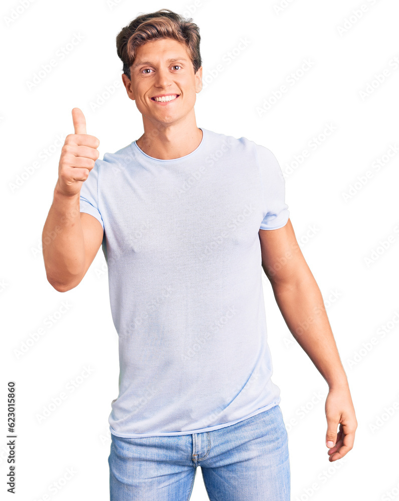 Young handsome man wearing casual clothes smiling happy and positive, thumb up doing excellent and approval sign Young handsome man wearing casual clothes smiling happy and positive, thumb up doing excellent and approval sign
