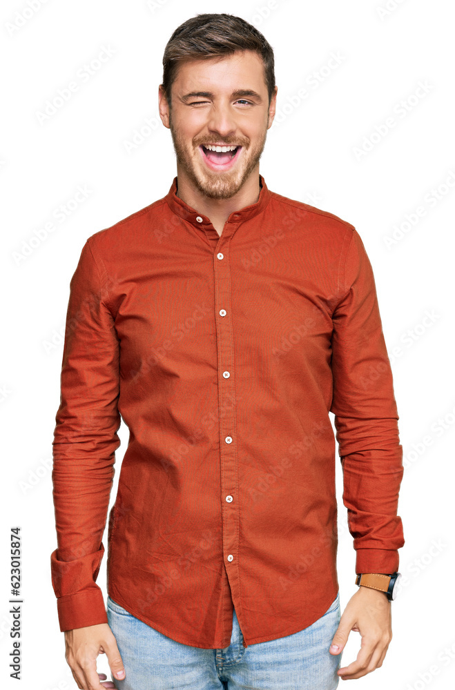 Handsome caucasian man wearing casual clothes winking looking at the camera with sexy expression, cheerful and happy face. Handsome caucasian man wearing casual clothes winking looking at the camera with sexy expression, cheerful and happy face.
