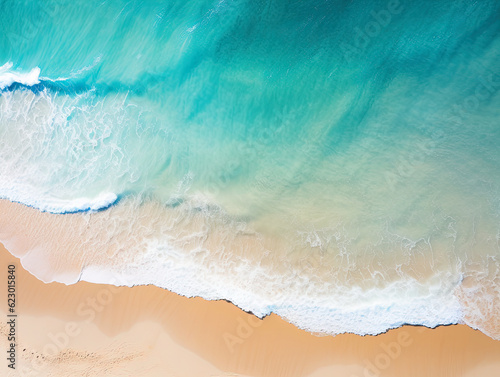 Beautiful ariel shot of a tropical beach with wavs breaking on sand
