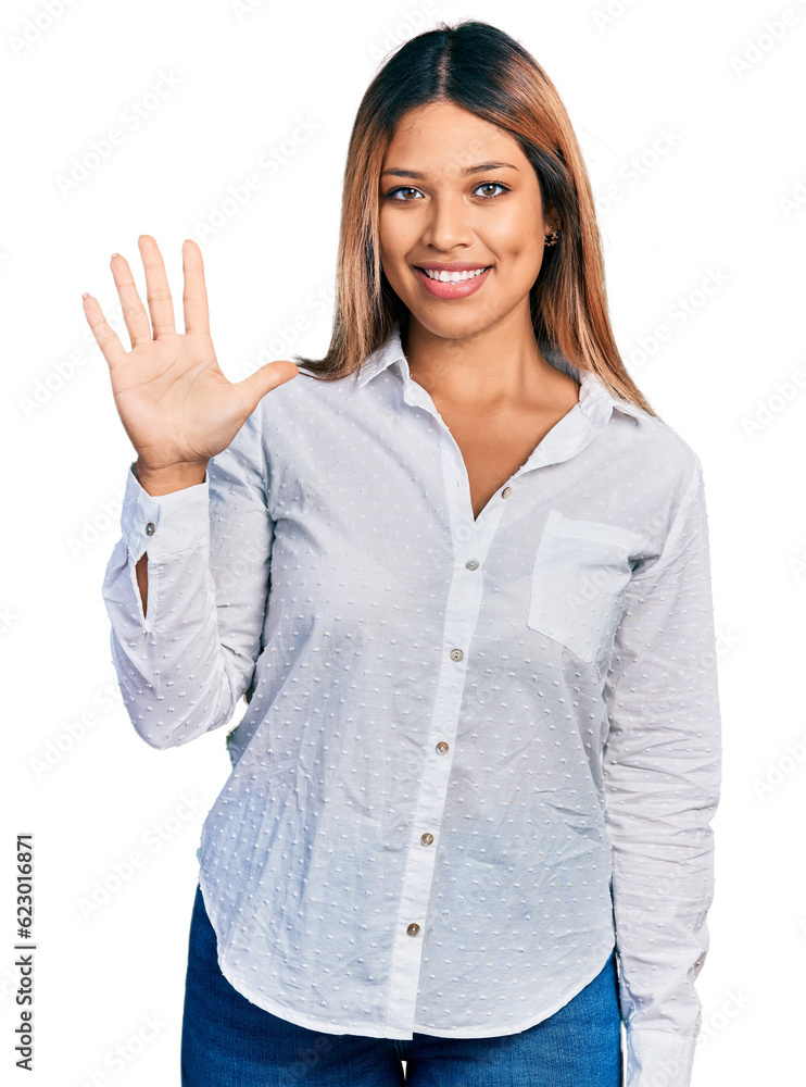 Young hispanic woman wearing casual white shirt showing and pointing up with fingers number five while smiling confident and happy. Young hispanic woman wearing casual white shirt showing and pointing up with fingers number five while smiling confident and happy.