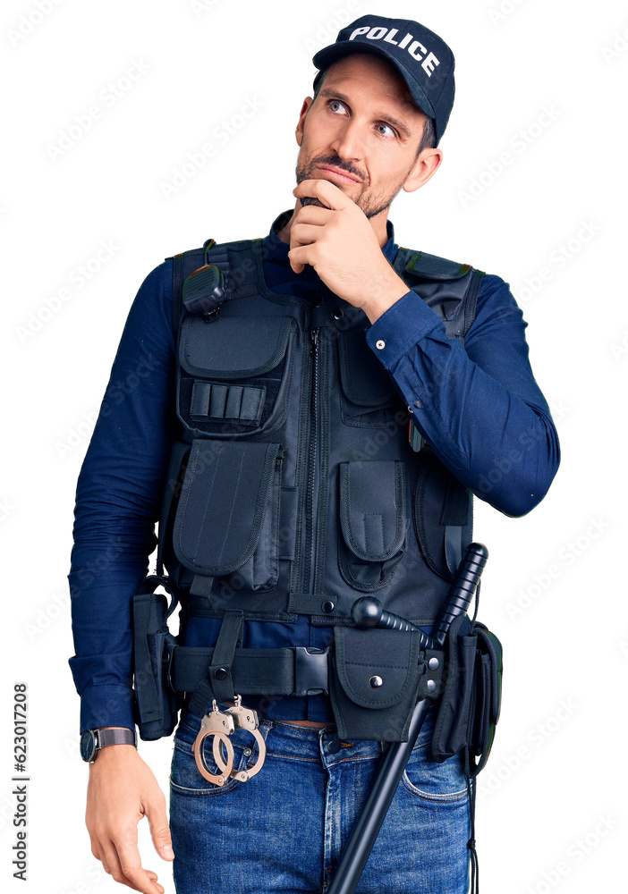 Young handsome man wearing police uniform with hand on chin thinking about question, pensive expression. smiling with thoughtful face. doubt concept. Young handsome man wearing police uniform with hand on chin thinking about question, pensive expression. smiling with thoughtful face. doubt concept.