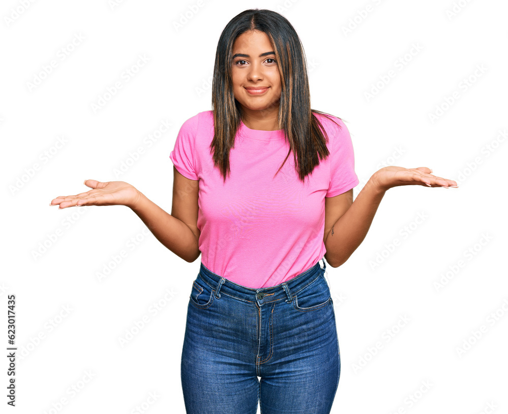 Young latin girl wearing casual clothes clueless and confused expression with arms and hands raised. doubt concept. Young latin girl wearing casual clothes clueless and confused expression with arms and hands raised. doubt concept.