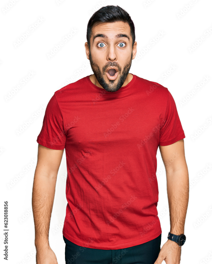 Young hispanic man wearing casual clothes scared and amazed with open mouth for surprise, disbelief face Young hispanic man wearing casual clothes scared and amazed with open mouth for surprise, disbelief face