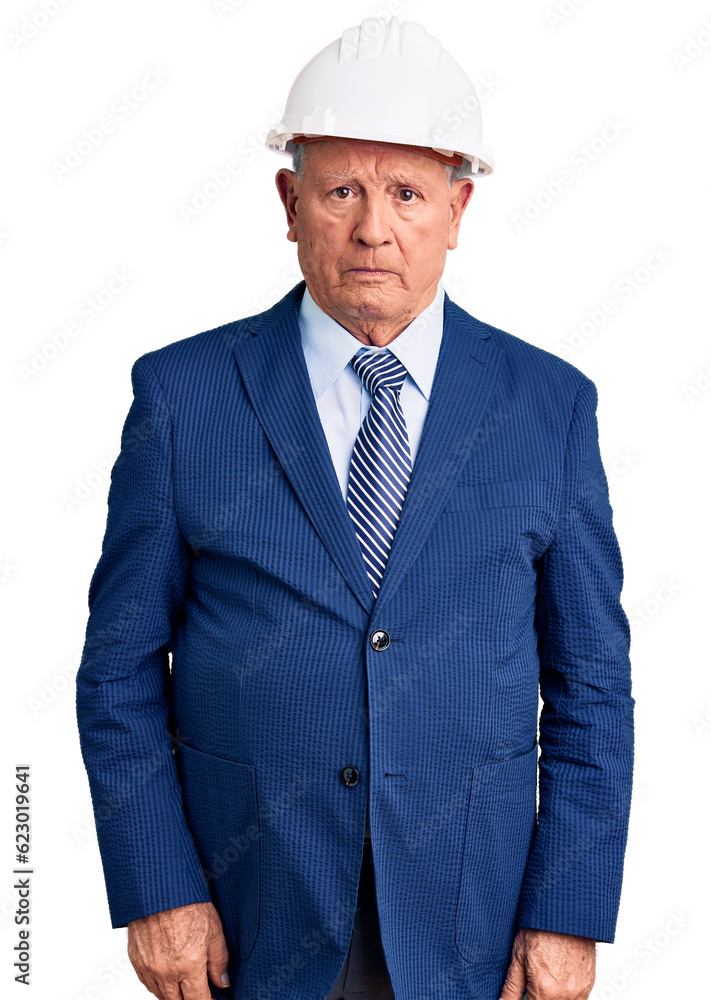 Senior handsome grey-haired man wearing suit and architect hardhat skeptic and nervous, frowning upset because of problem. negative person. Senior handsome grey-haired man wearing suit and architect hardhat skeptic and nervous, frowning upset because of problem. negative person.
