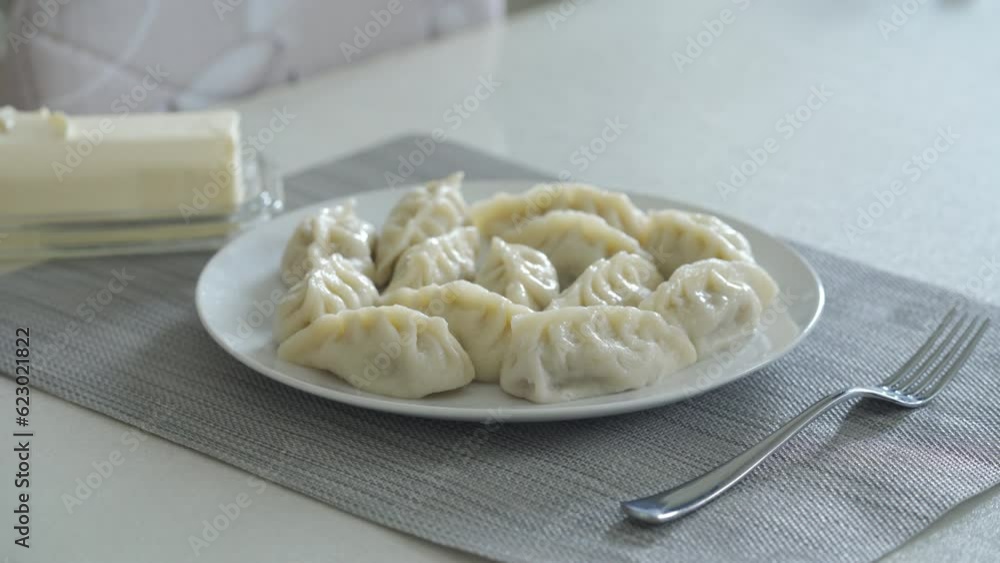 Plate with portion of Kurze traditional dumplings on the table. Kurze traditional dumplings from Dagestan, Russia Plate with portion of Kurze traditional dumplings on the table. Kurze traditional dumplings from Dagestan, Russia