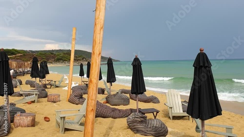 Pan shot of an abandoned beach bar on coast of Ammolofoi Beach Kavala in Greece photo