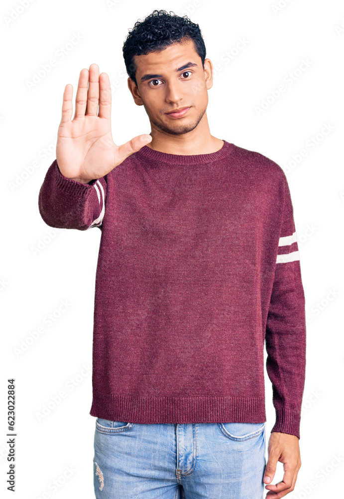 Hispanic handsome young man wearing casual clothes doing stop sing with palm of the hand. warning expression with negative and serious gesture on the face. Hispanic handsome young man wearing casual clothes doing stop sing with palm of the hand. warning expression with negative and serious gesture on the face.