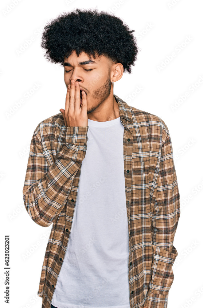 Young african american man with afro hair wearing casual clothes bored yawning tired covering mouth with hand. restless and sleepiness. Young african american man with afro hair wearing casual clothes bored yawning tired covering mouth with hand. restless and sleepiness.