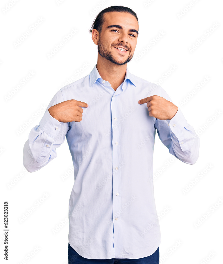 Young handsome man wearing business clothes looking confident with smile on face, pointing oneself with fingers proud and happy. Young handsome man wearing business clothes looking confident with smile on face, pointing oneself with fingers proud and happy.