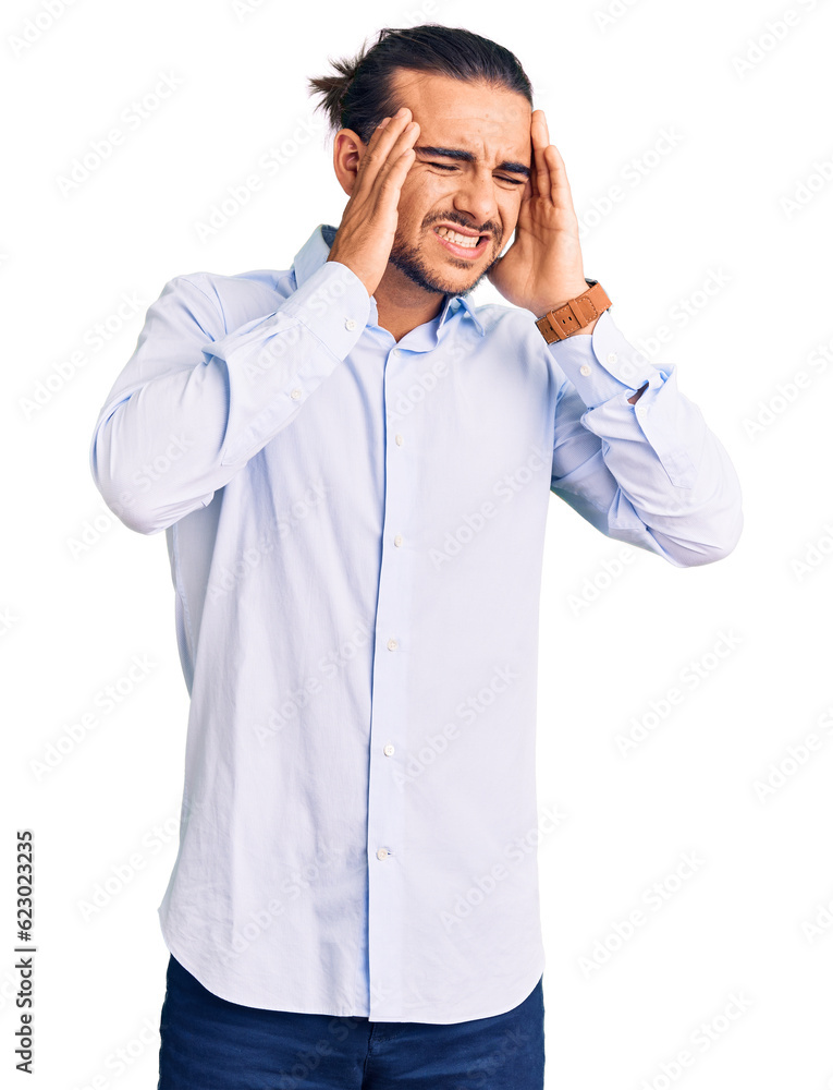 Young handsome man wearing business clothes with hand on head, headache because stress. suffering migraine. Young handsome man wearing business clothes with hand on head, headache because stress. suffering migraine.