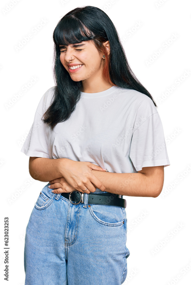 Young hispanic girl wearing casual clothes with hand on stomach because nausea, painful disease feeling unwell. ache concept. Young hispanic girl wearing casual clothes with hand on stomach because nausea, painful disease feeling unwell. ache concept.