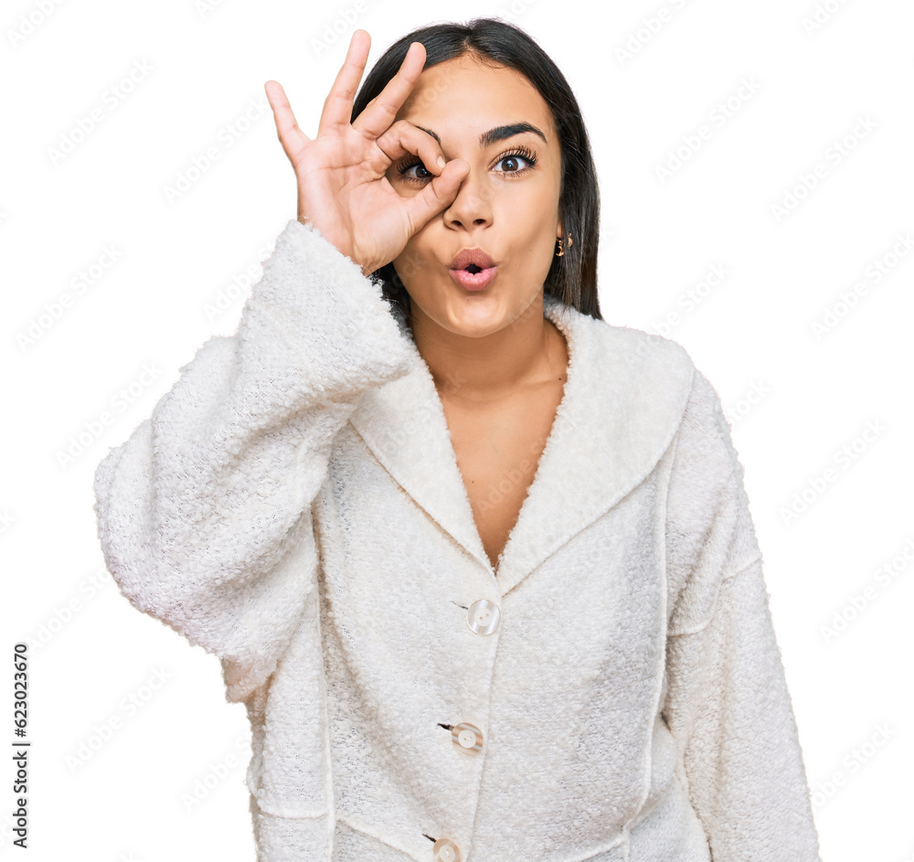 Young brunette woman wearing casual clothes doing ok gesture shocked with surprised face, eye looking through fingers. unbelieving expression. Young brunette woman wearing casual clothes doing ok gesture shocked with surprised face, eye looking through fingers. unbelieving expression.