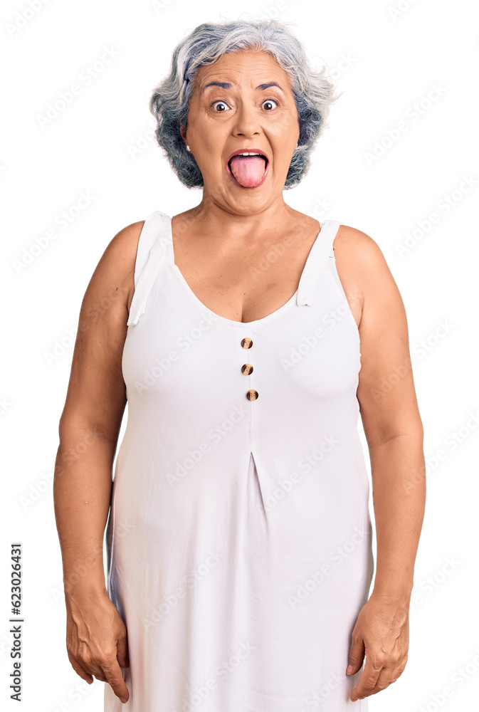 Senior woman with gray hair wearing casual clothes sticking tongue out happy with funny expression. emotion concept. Senior woman with gray hair wearing casual clothes sticking tongue out happy with funny expression. emotion concept.