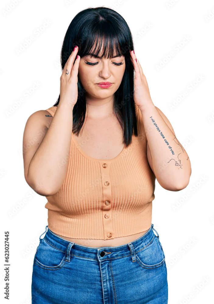 Young hispanic plus size woman wearing casual clothes with hand on head for pain in head because stress. suffering migraine. Young hispanic plus size woman wearing casual clothes with hand on head for pain in head because stress. suffering migraine.