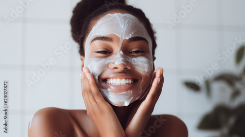 Close up beauty girl with freckles and thick eyebrows, applying moisturizing skincare cream, lotion or mask for skin lifting and anti-aging detoxifying effect, white background. photo