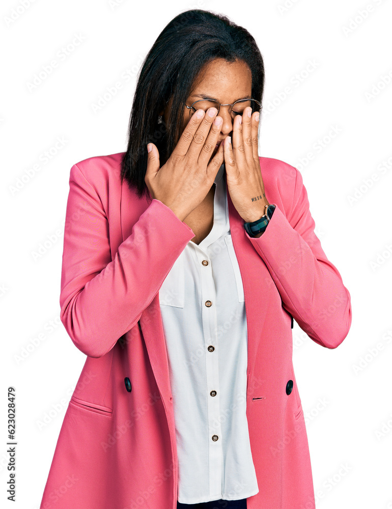 Beautiful hispanic woman wearing business jacket rubbing eyes for fatigue and headache, sleepy and tired expression. vision problem Beautiful hispanic woman wearing business jacket rubbing eyes for fatigue and headache, sleepy and tired expression. vision problem