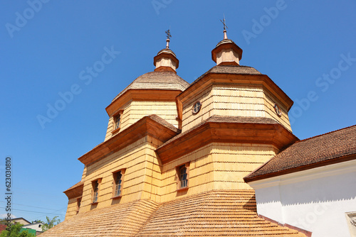 Vintage wooden Church of the Holy Trinity in Zhovkva, Ukraine photo