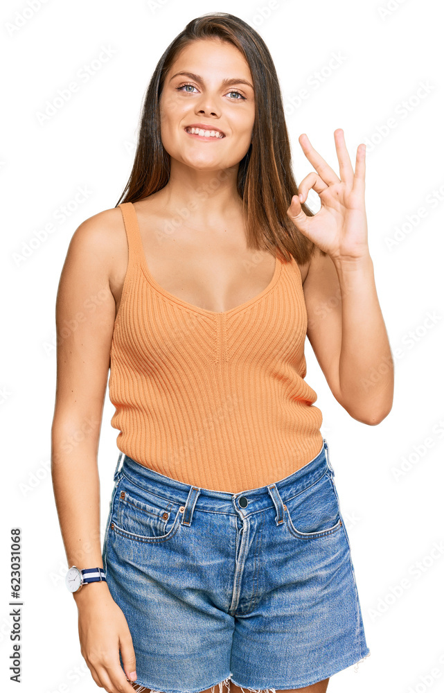 Young caucasian woman wearing casual clothes smiling positive doing ok sign with hand and fingers. successful expression. Young caucasian woman wearing casual clothes smiling positive doing ok sign with hand and fingers. successful expression.