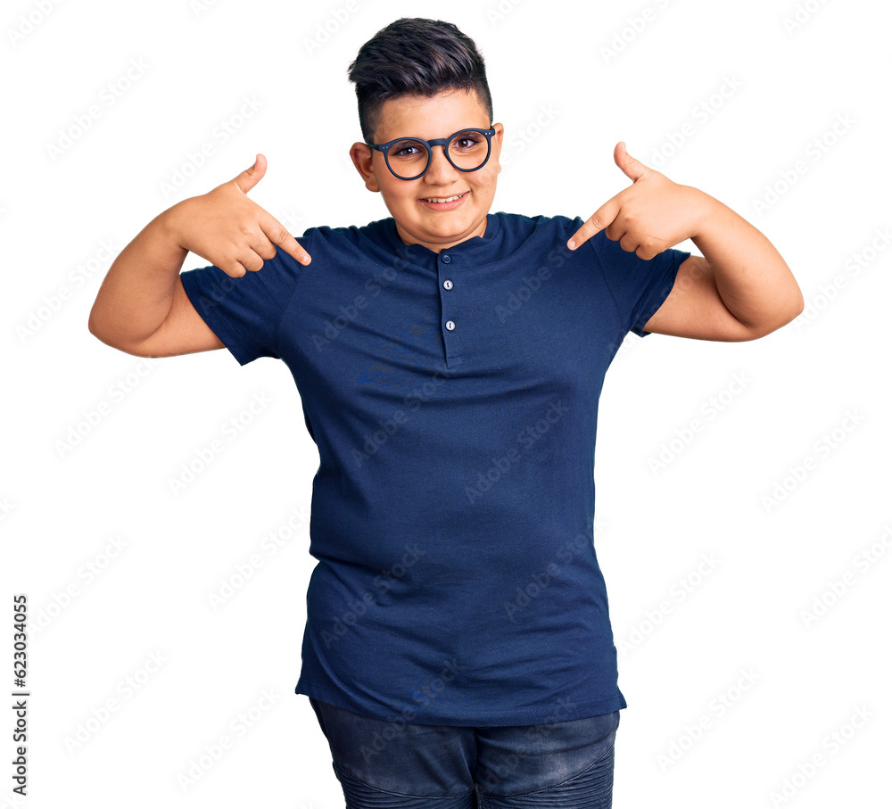 Little boy kid wearing casual clothes and glasses looking confident with smile on face, pointing oneself with fingers proud and happy. Little boy kid wearing casual clothes and glasses looking confident with smile on face, pointing oneself with fingers proud and happy.