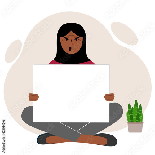 A woman sits cross-legged and holds a large white sheet with space for text. Advertising, poster, information, announcement.