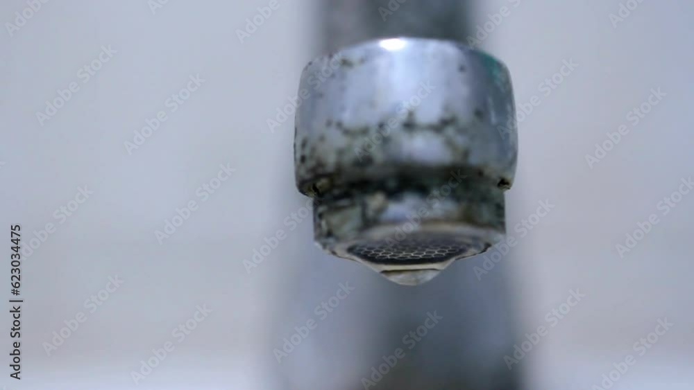 close-up kitchen faucet that is still open dripping water HD 4k close-up kitchen faucet that is still open dripping water HD 4k