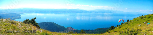 Paraglider flying over the Lake Ohrid in southwest of macedonia panorama image