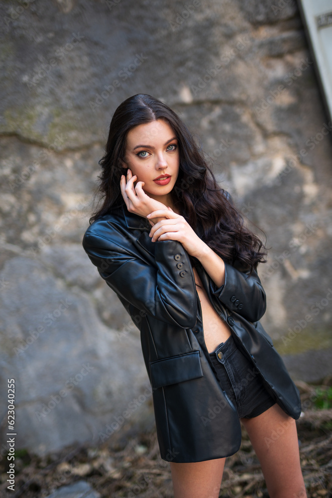 beautiful girl in shorts and black jacket. selective focus beautiful girl in shorts and black jacket. selective focus