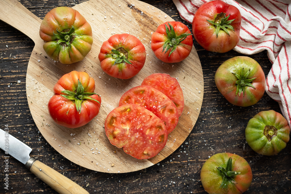 Fresh tomatoes on wooden board, top view, horizontal..healthy food concept. Summer salad. Fresh tomatoes on wooden board, top view, horizontal..healthy food concept. Summer salad.