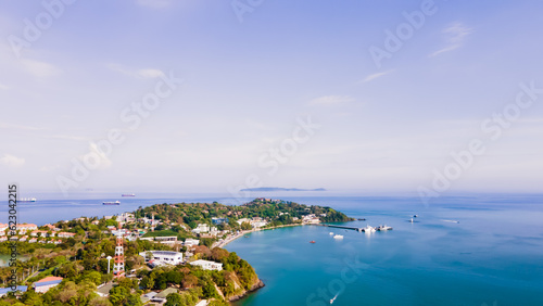 Fototapeta Naklejka Na Ścianę i Meble -  Aerial view of blue water surface background and sun reflection. aerial view of a flying drone Waves surface on a tropical ocean with bright sunlight. Perfect for vacations, 