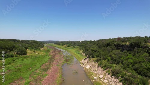 Aerial footage of the Pedernales River in Spicewood Texas.  The river is extremely low. photo