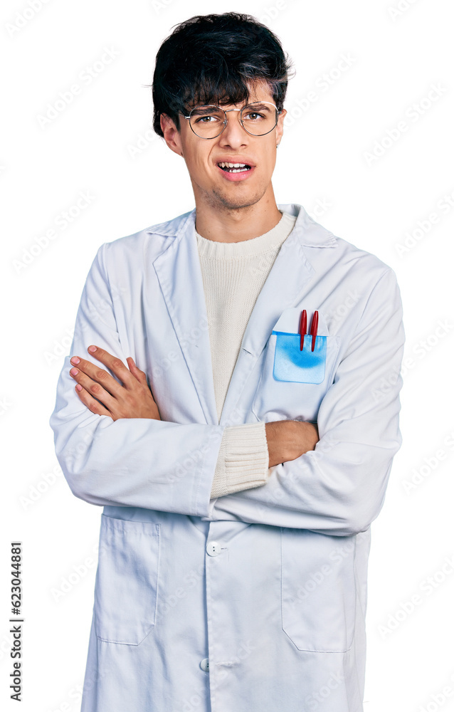 Handsome hipster young man with crossed arms wearing doctor uniform clueless and confused expression. doubt concept. Handsome hipster young man with crossed arms wearing doctor uniform clueless and confused expression. doubt concept.