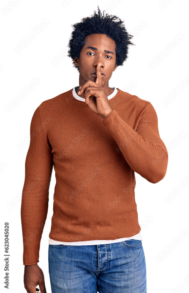 Handsome african american man with afro hair wearing casual clothes asking to be quiet with finger on lips. silence and secret concept. Handsome african american man with afro hair wearing casual clothes asking to be quiet with finger on lips. silence and secret concept.