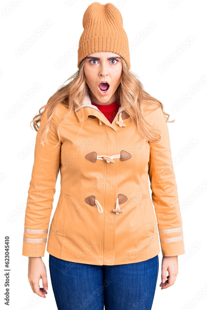 Young caucasian woman wearing casual clothes scared and amazed with open mouth for surprise, disbelief face Young caucasian woman wearing casual clothes scared and amazed with open mouth for surprise, disbelief face