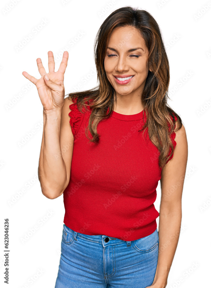 Young hispanic woman wearing casual clothes showing and pointing up with fingers number four while smiling confident and happy. Young hispanic woman wearing casual clothes showing and pointing up with fingers number four while smiling confident and happy.