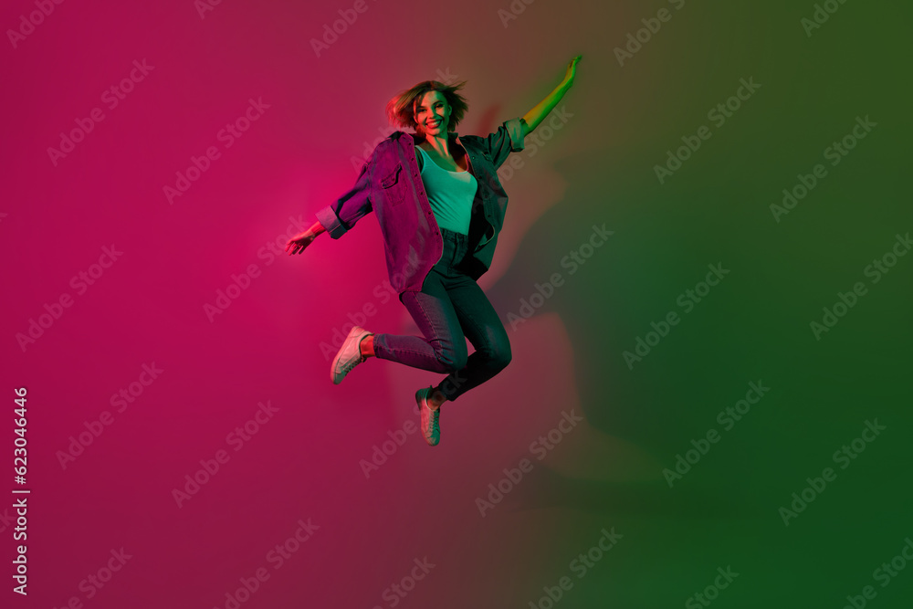 Full size photo of cheerful lady enjoy weekend clubbing in futuristic nightclub isolated on vivid neon color background