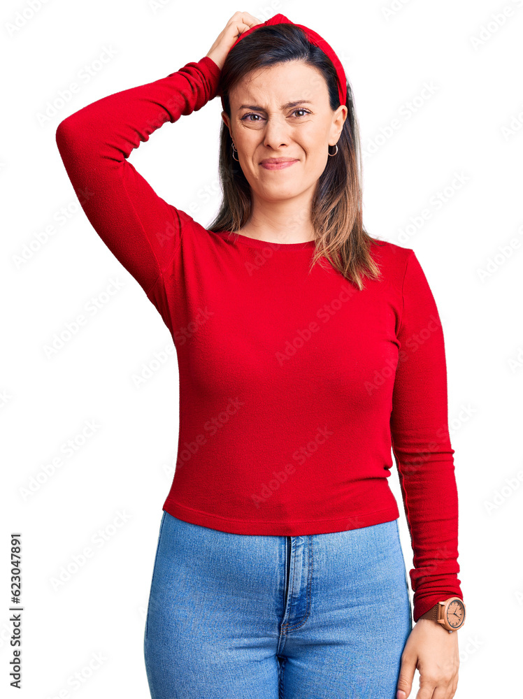 Young beautiful woman wearing casual clothes confuse and wonder about question. uncertain with doubt, thinking with hand on head. pensive concept. Young beautiful woman wearing casual clothes confuse and wonder about question. uncertain with doubt, thinking with hand on head. pensive concept.