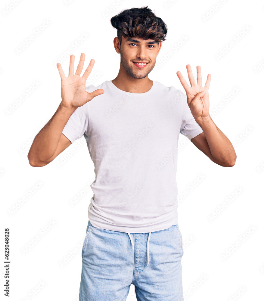 Young hispanic man wearing casual clothes showing and pointing up with fingers number nine while smiling confident and happy. Young hispanic man wearing casual clothes showing and pointing up with fingers number nine while smiling confident and happy.