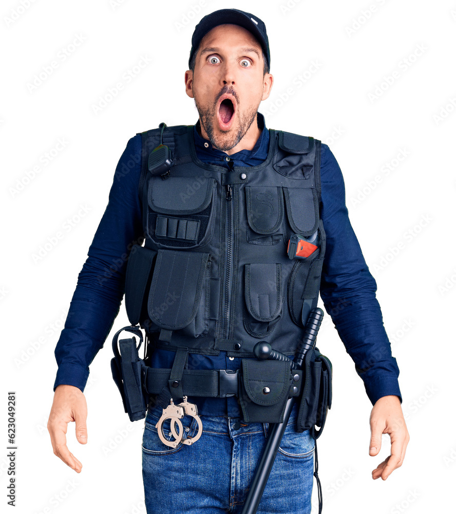 Young handsome man wearing police uniform afraid and shocked with surprise and amazed expression, fear and excited face. Young handsome man wearing police uniform afraid and shocked with surprise and amazed expression, fear and excited face.