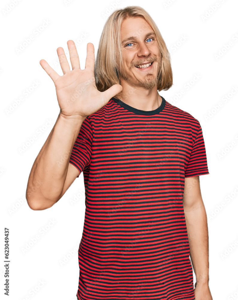 Caucasian man with blond long hair wearing casual striped t shirt showing and pointing up with fingers number five while smiling confident and happy. Caucasian man with blond long hair wearing casual striped t shirt showing and pointing up with fingers number five while smiling confident and happy.