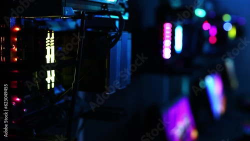 A top-end system unit for a gaming computer in close-up with neon illumination