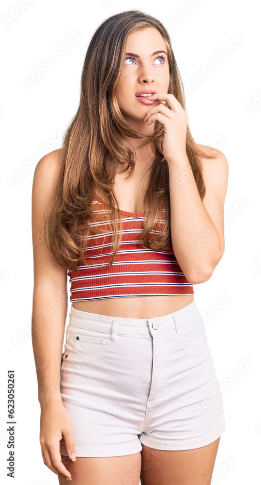 Beautiful caucasian young woman wearing casual clothes looking stressed and nervous with hands on mouth biting nails. anxiety problem. Beautiful caucasian young woman wearing casual clothes looking stressed and nervous with hands on mouth biting nails. anxiety problem.