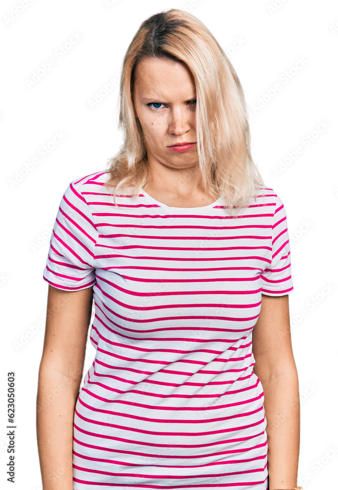 Young caucasian woman wearing casual clothes skeptic and nervous, frowning upset because of problem. negative person. Young caucasian woman wearing casual clothes skeptic and nervous, frowning upset because of problem. negative person.