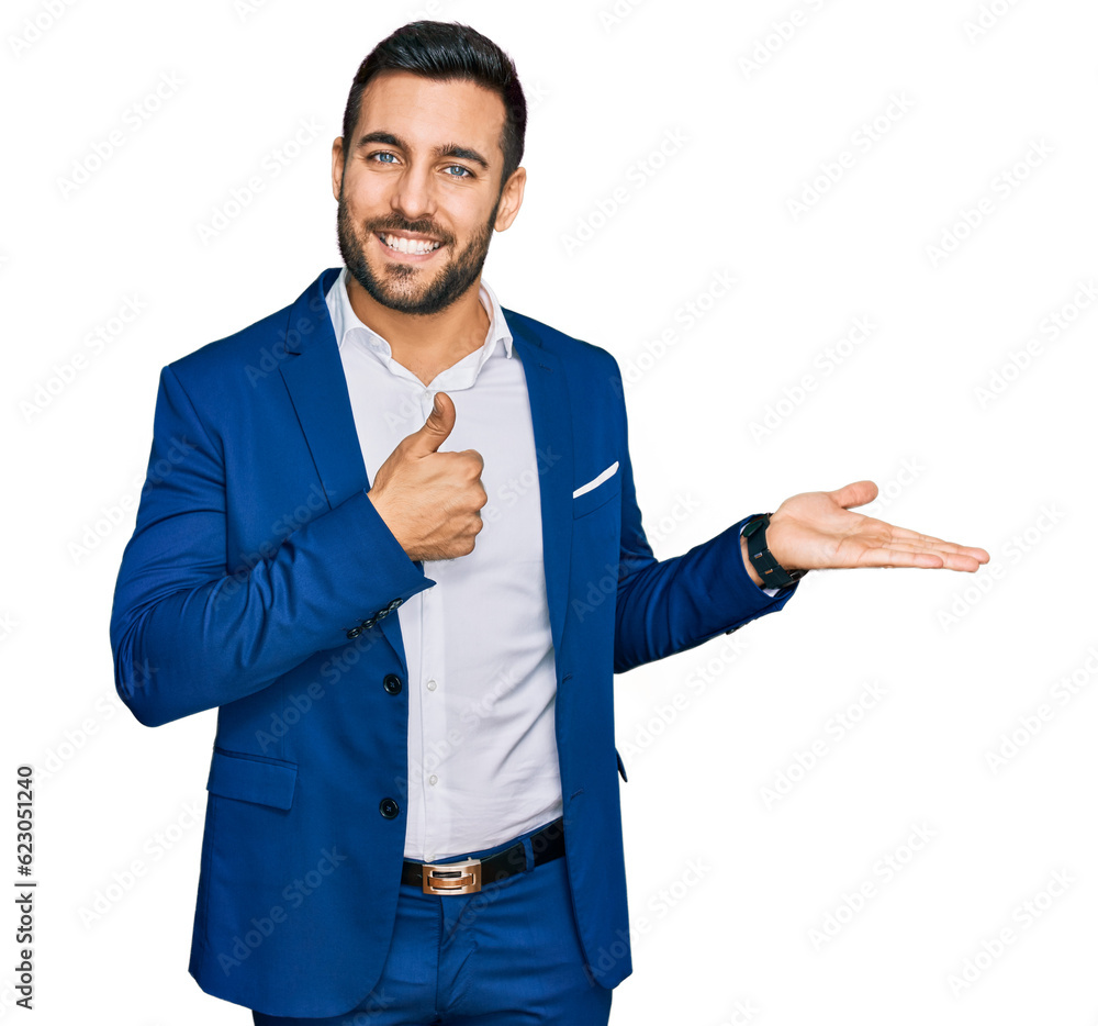 Young hispanic man wearing business jacket showing palm hand and doing ok gesture with thumbs up, smiling happy and cheerful Young hispanic man wearing business jacket showing palm hand and doing ok gesture with thumbs up, smiling happy and cheerful