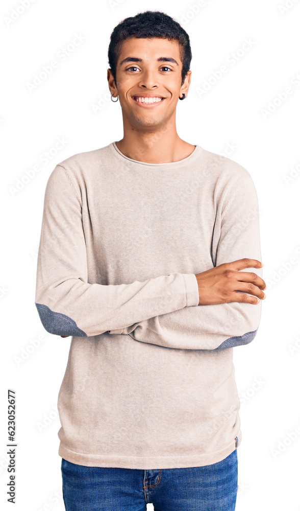 Young african amercian man wearing casual clothes happy face smiling with crossed arms looking at the camera. positive person. Young african amercian man wearing casual clothes happy face smiling with crossed arms looking at the camera. positive person.