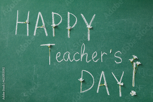 Happy teacher's day greetings, inscription on a green board