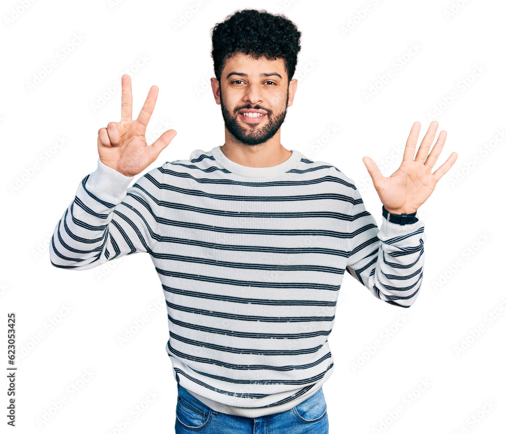 Young arab man with beard wearing casual striped sweater showing and pointing up with fingers number eight while smiling confident and happy. Young arab man with beard wearing casual striped sweater showing and pointing up with fingers number eight while smiling confident and happy.