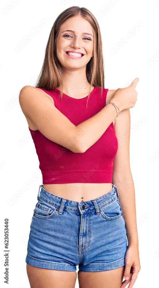 Young beautiful blonde woman wearing elegant summer shirt cheerful with a smile of face pointing with hand and finger up to the side with happy and natural expression on face Young beautiful blonde woman wearing elegant summer shirt cheerful with a smile of face pointing with hand and finger up to the side with happy and natural expression on face