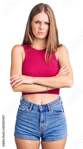 Young beautiful blonde woman wearing elegant summer shirt skeptic and nervous, disapproving expression on face with crossed arms. negative person. © Krakenimages.com