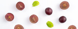 Delicious bunch of grapes fruit spilled over white table background.