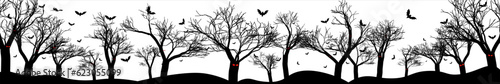 Scary black forest silhouette with groups flying bats isolated on white background. Perfect for Halloween Backgrounds. Vector Illustration. EPS 10.